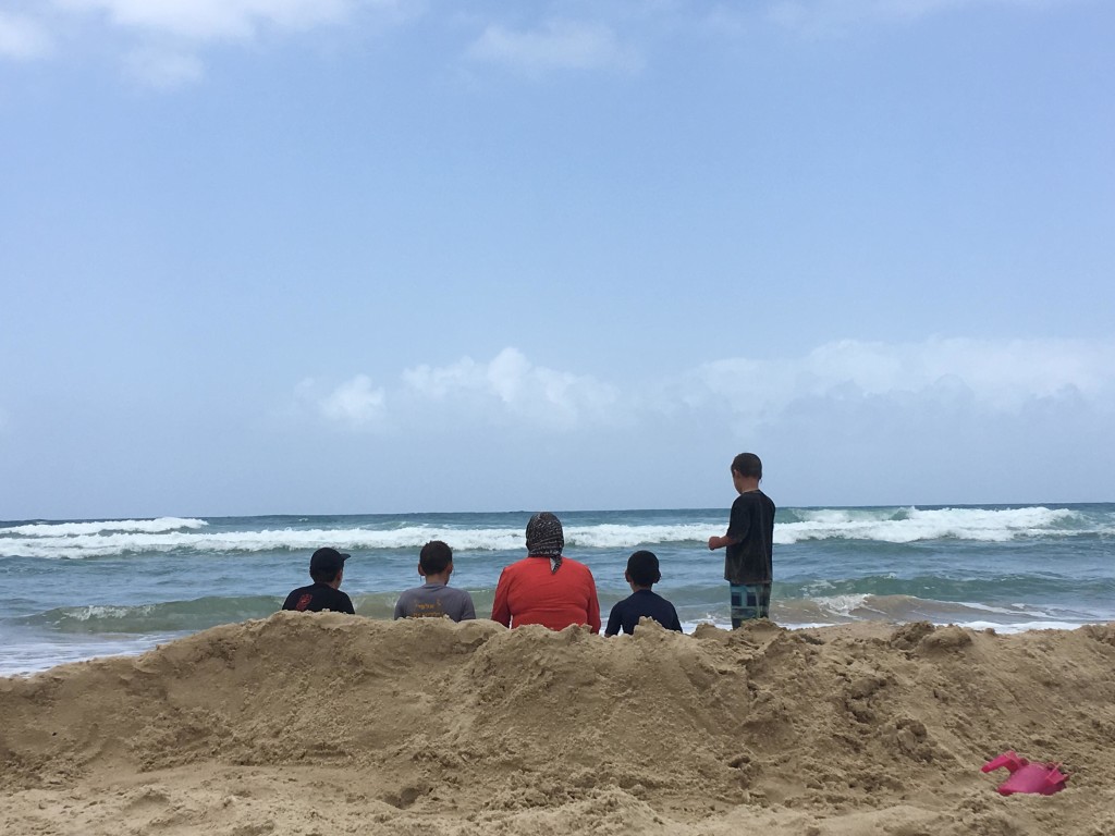 You know what kids want from us? Our time and presence. Me with the boys waiting for the waves to wash over us.